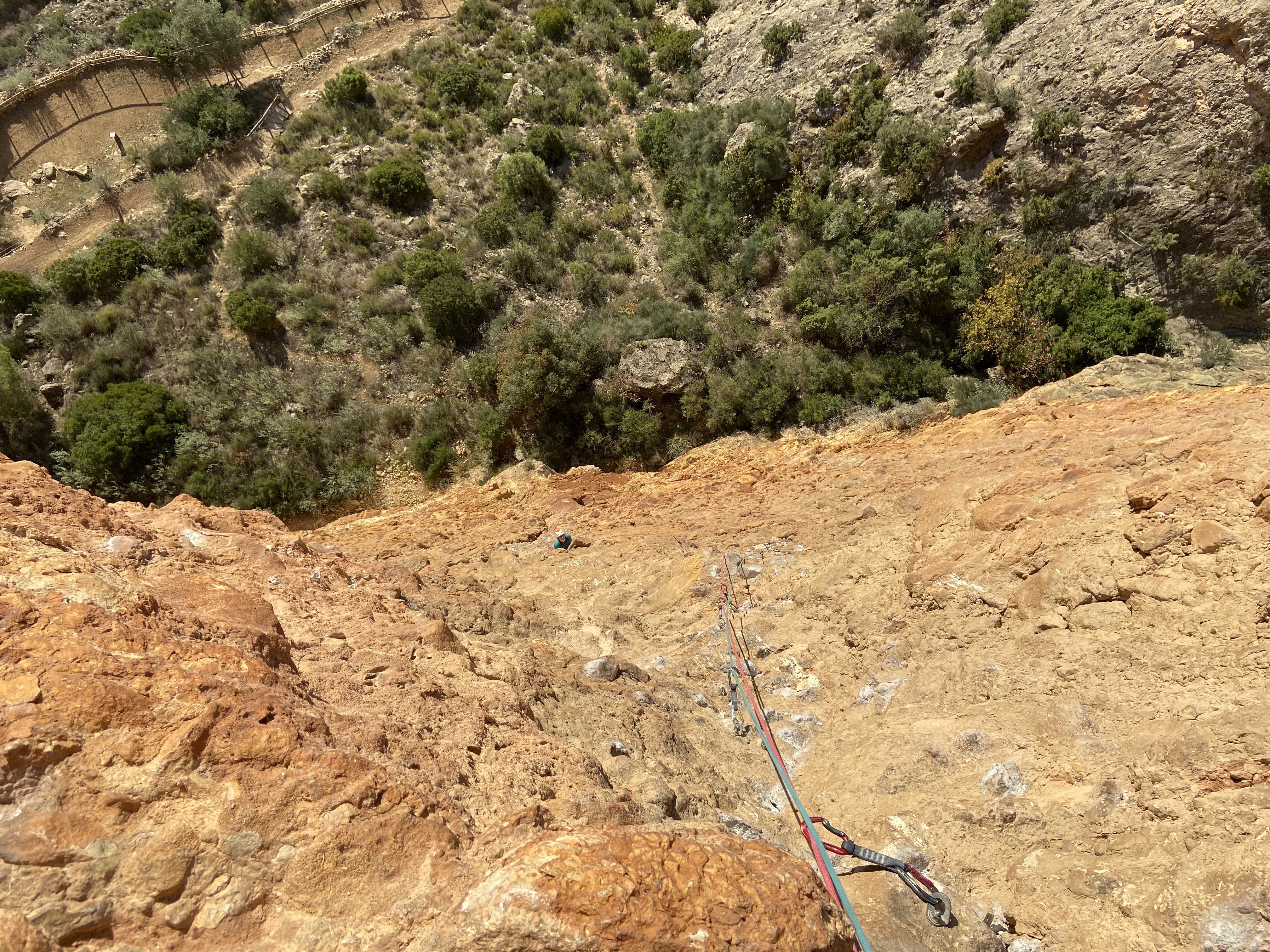 View looking down from the multi pitch route. There are lots of chalked "potatos" conglomerate rocks