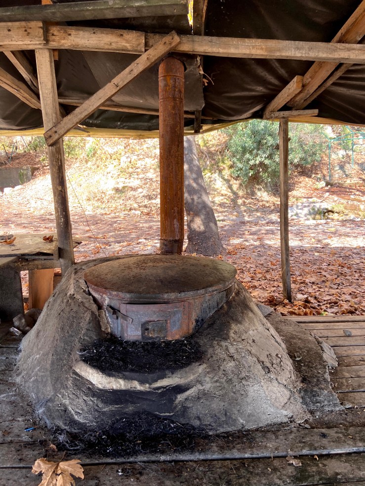 Oven with a large surface area on top to cook the bread and dough. On the front there is a hatch which they put the wood and start a fire underneath