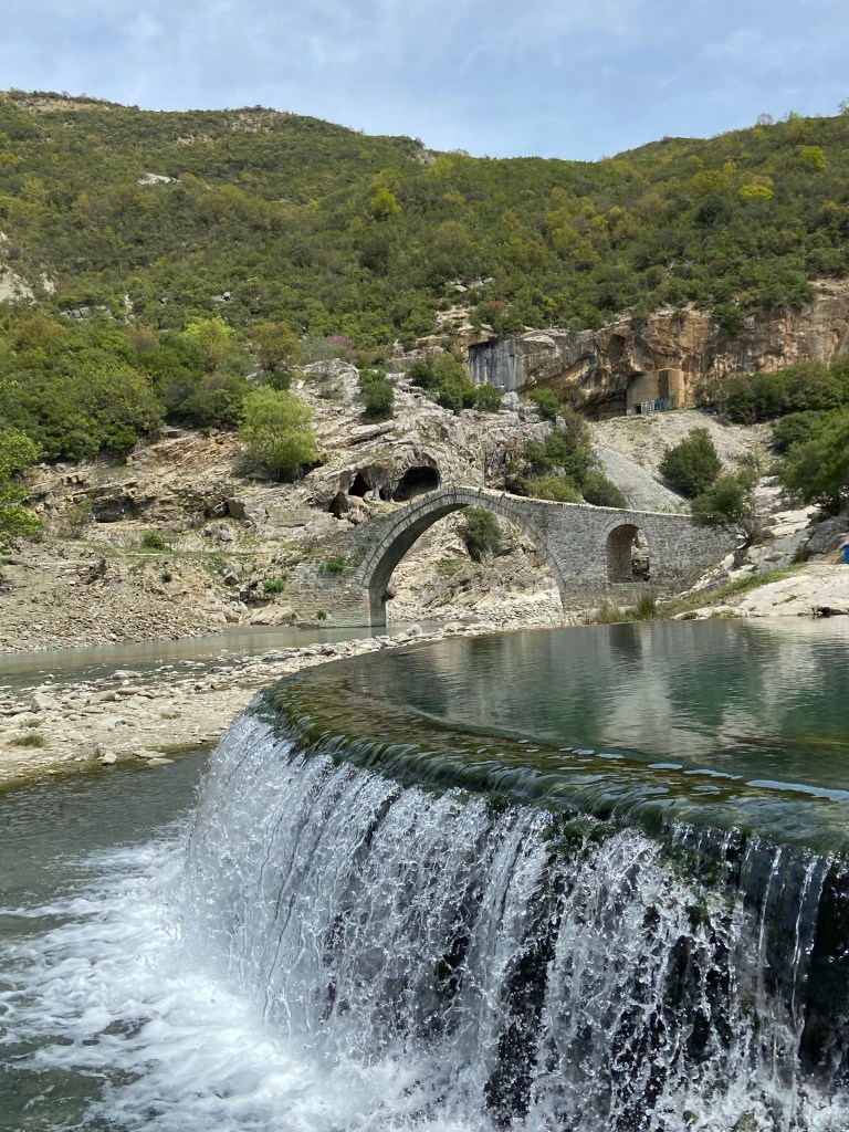 An infinity pool style hot spring sits by the river, close to an 18th century Ottoman stone bridge. 