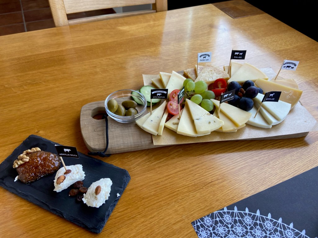 Decorative cheese boards filled with 9 different labelled cheeses