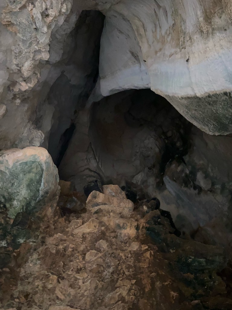 Inside a cave which has smooth and dusty walls