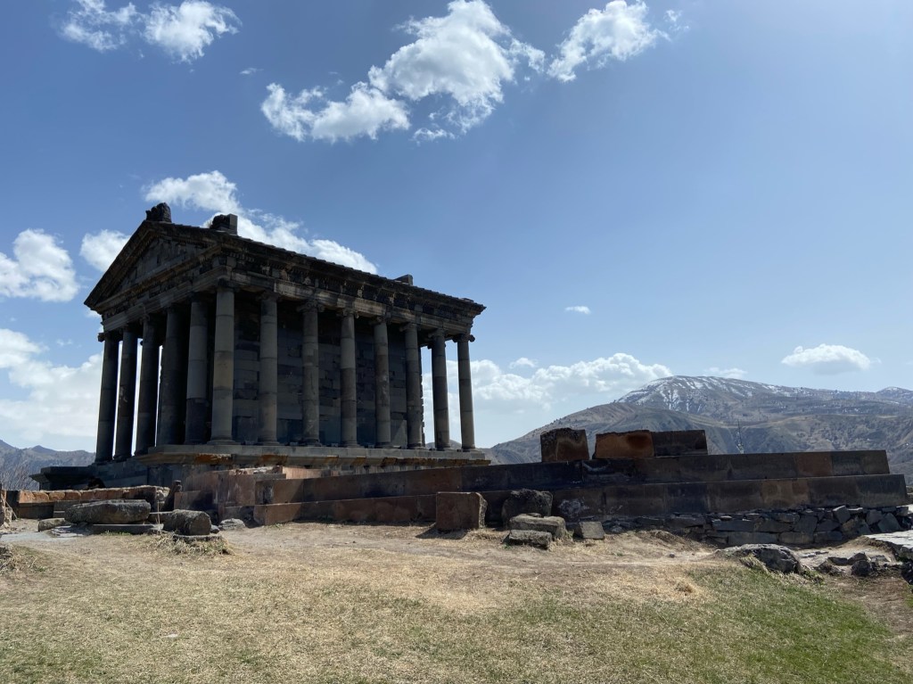 Greek style temple with large columns surround a building