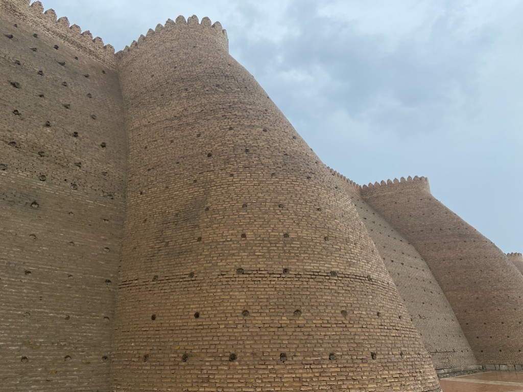 Sturdy brick fortress walls with turret-like structures placed along the wall