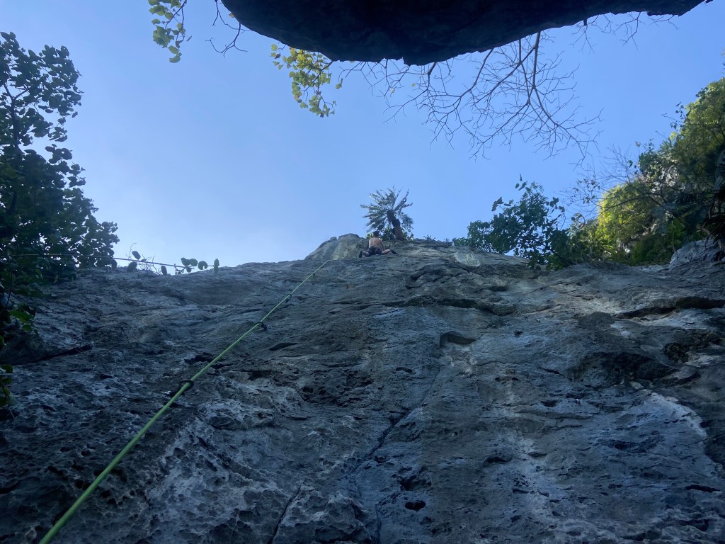 Climber on the compact grey rock at Khao Chin Lae