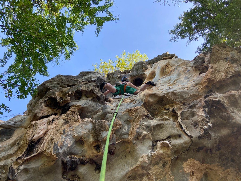 Climber on smooth but featured limestone 