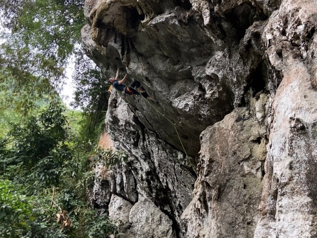 Climber on a steep but short limestone route  at Hidden Valley.