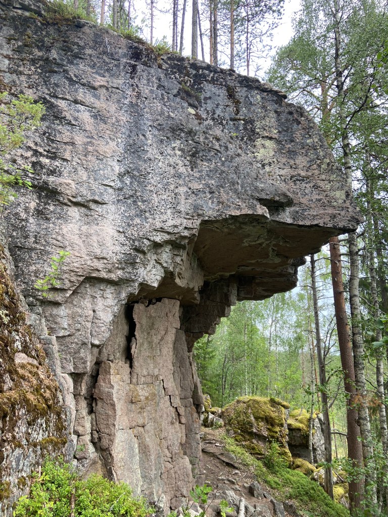 Steep overhanging vertical roof in the forest