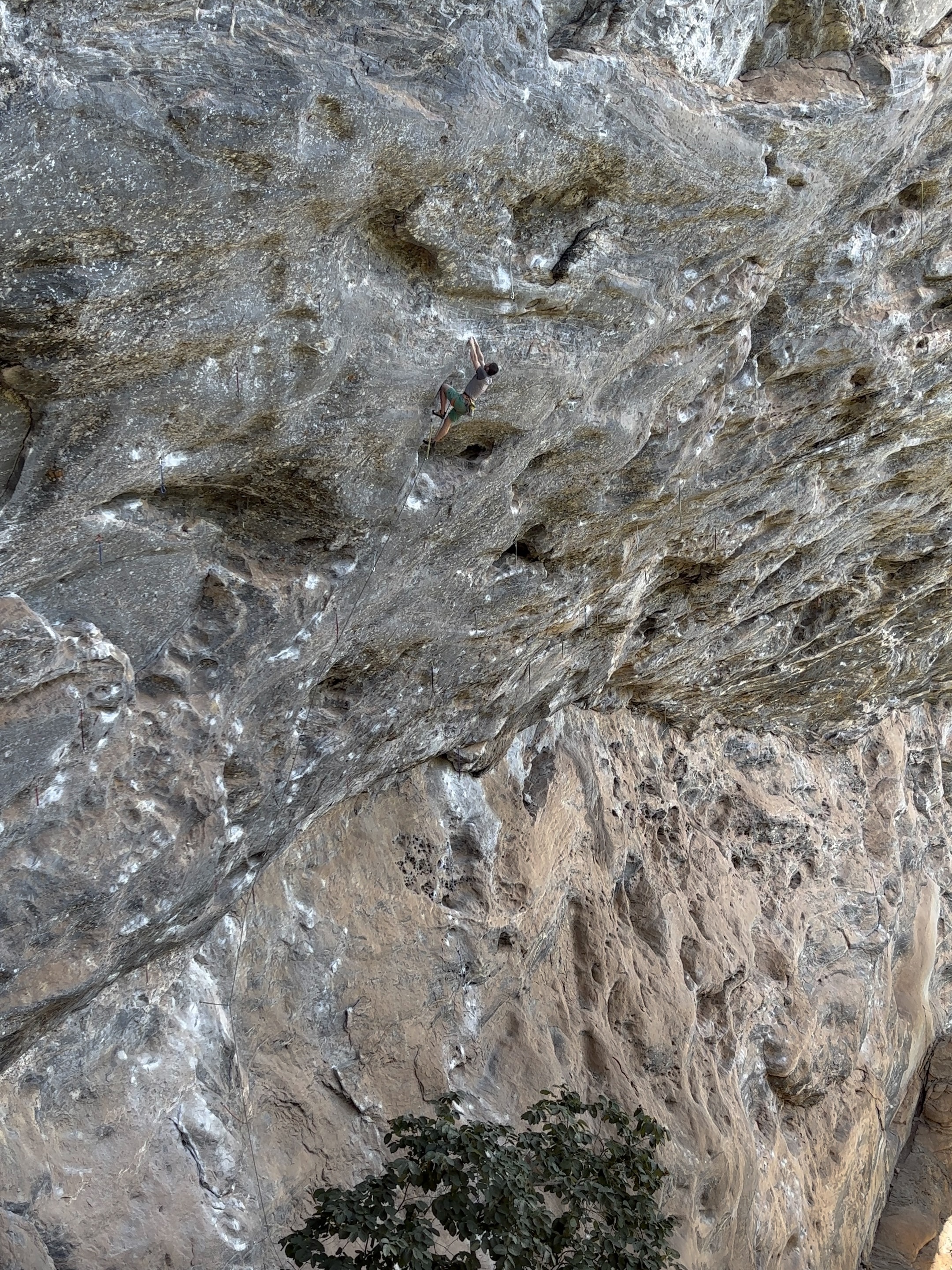 Climber battling the immense overhang of a gneiss cave roof. 