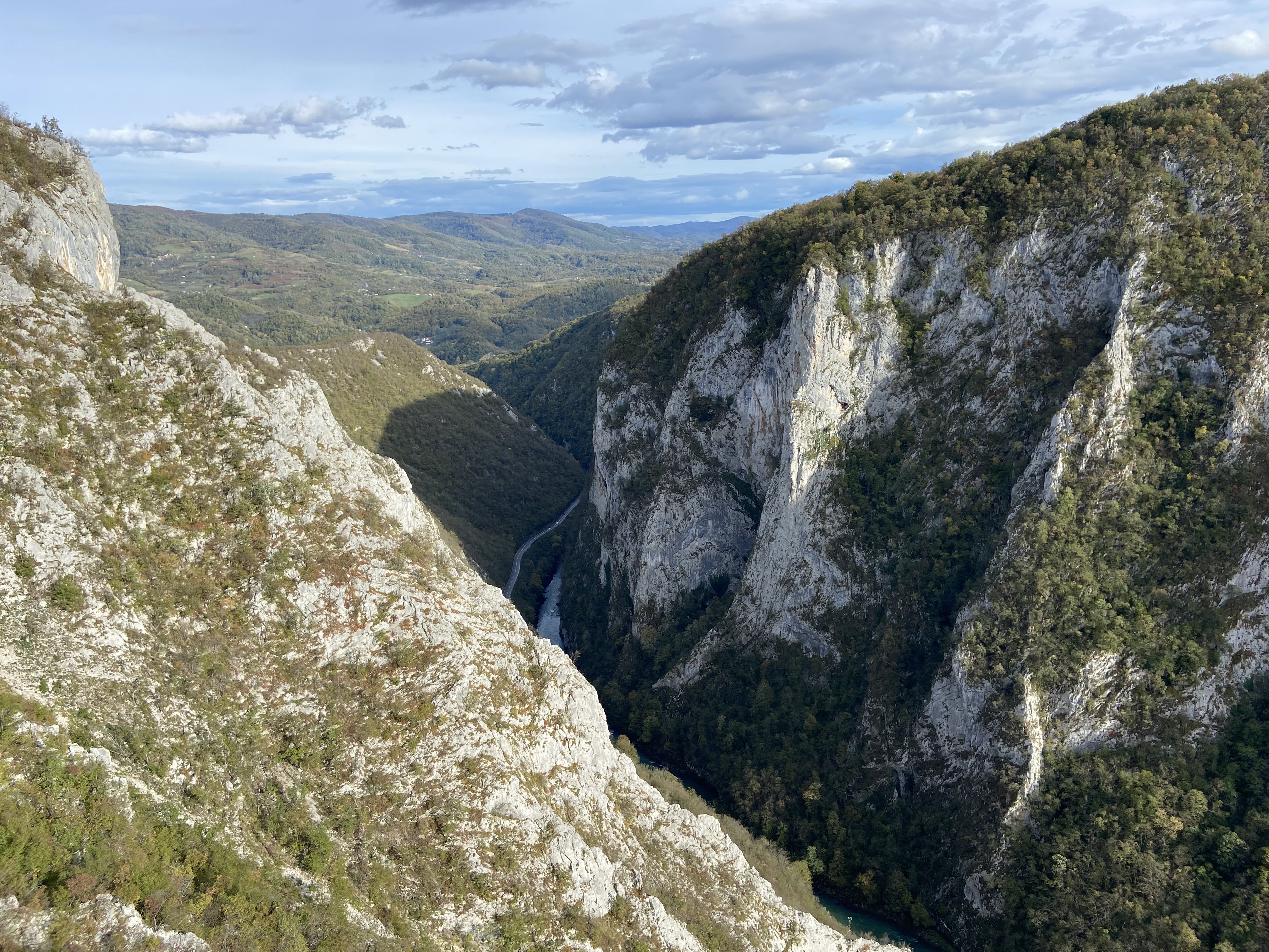 A view of the lush green vegetation and cliffs that line the exit of canyon Tijesno. 